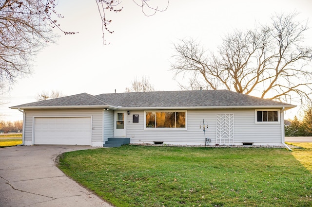 ranch-style house with a garage and a front yard