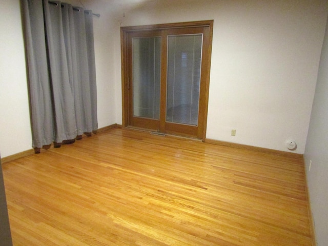 unfurnished room featuring light wood-type flooring