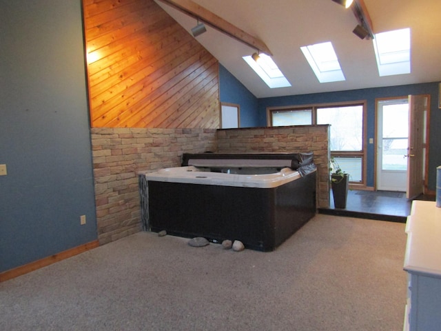 bathroom featuring lofted ceiling and a washtub