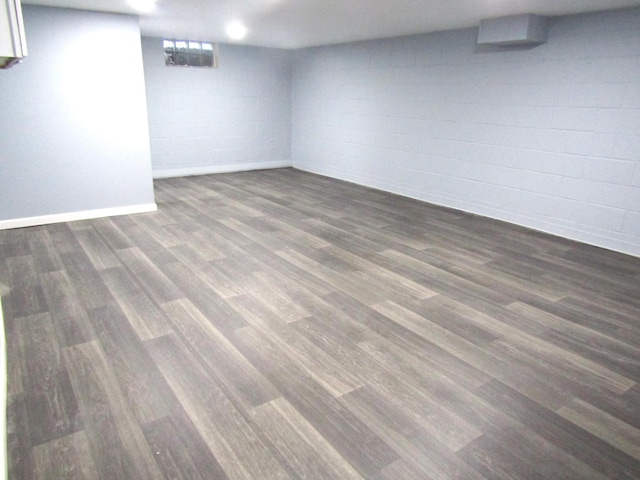 basement featuring dark hardwood / wood-style flooring