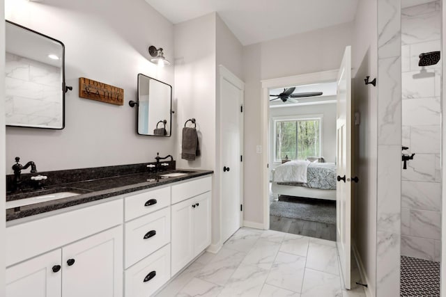 bathroom with double sink vanity, ceiling fan, and hardwood / wood-style floors