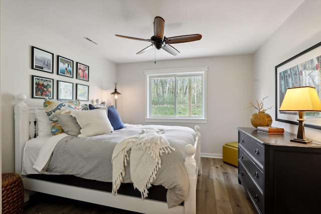 bedroom featuring hardwood / wood-style floors and ceiling fan