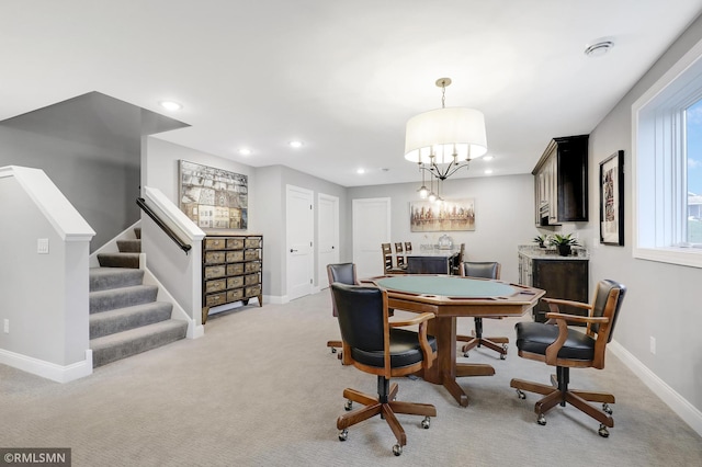 carpeted dining room featuring bar area