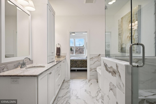 bathroom with vanity, tile walls, and walk in shower