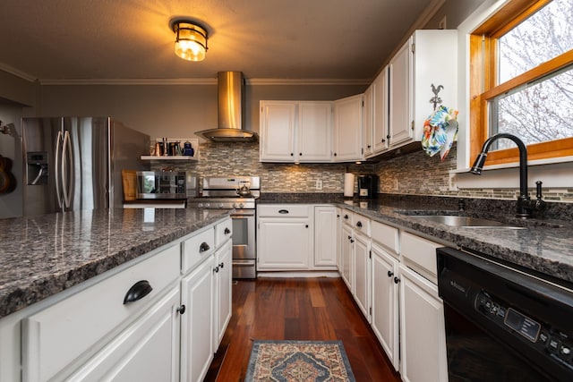 kitchen featuring sink, wall chimney exhaust hood, stainless steel appliances, backsplash, and white cabinets