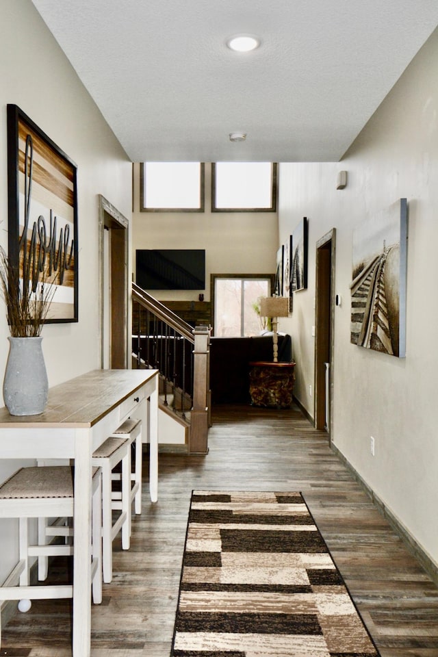 corridor featuring wood-type flooring