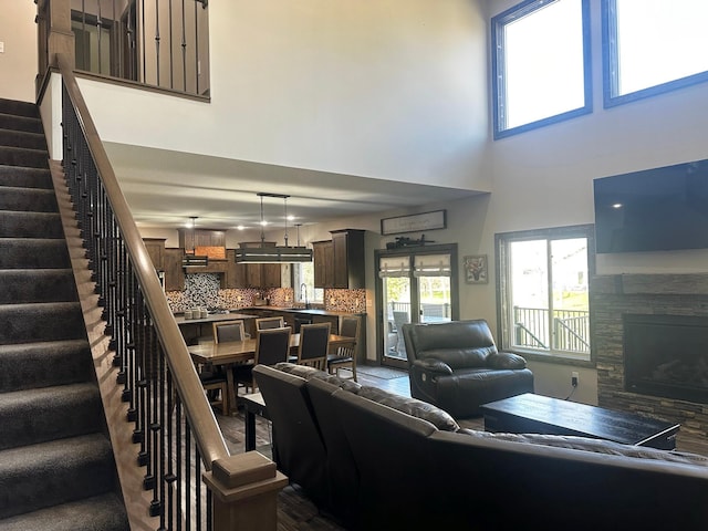 living room with sink and a high ceiling