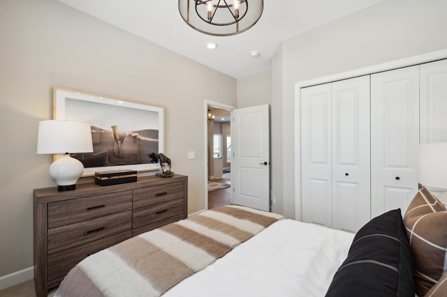 bedroom with a closet and hardwood / wood-style floors