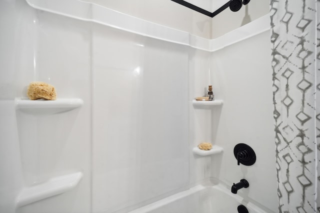 bathroom with shower / bathtub combination with curtain