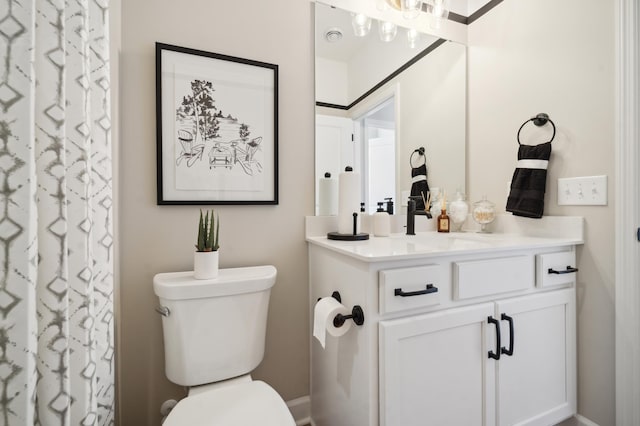 bathroom with toilet and vanity