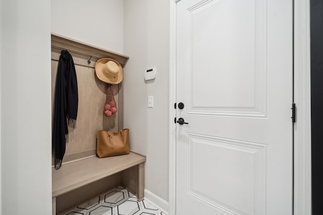 mudroom featuring light tile floors