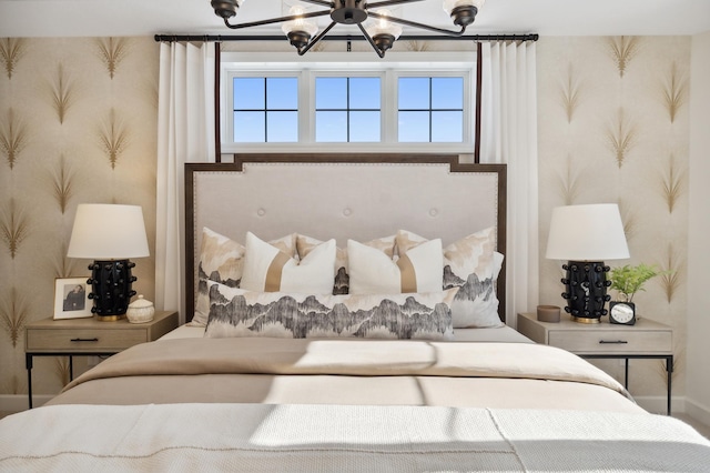 bedroom featuring an inviting chandelier