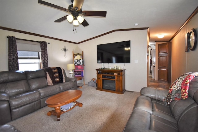 living room with ceiling fan, dark carpet, lofted ceiling, and ornamental molding