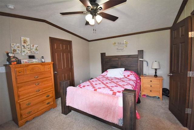 bedroom featuring ceiling fan, vaulted ceiling, light carpet, and ornamental molding