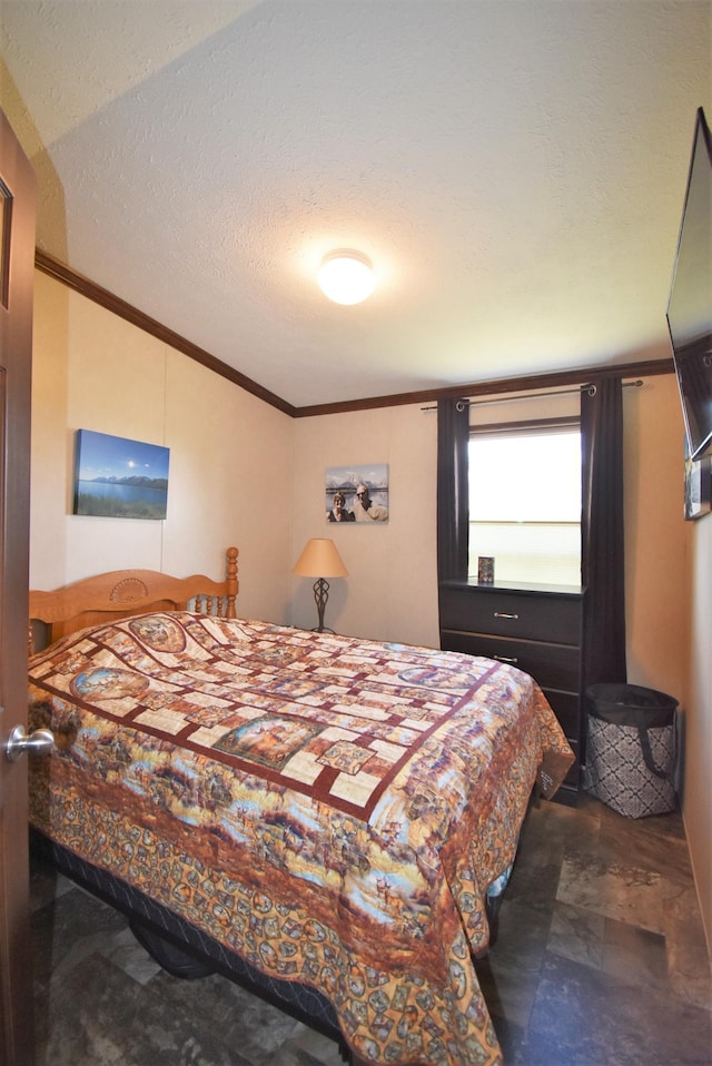 tiled bedroom featuring a textured ceiling