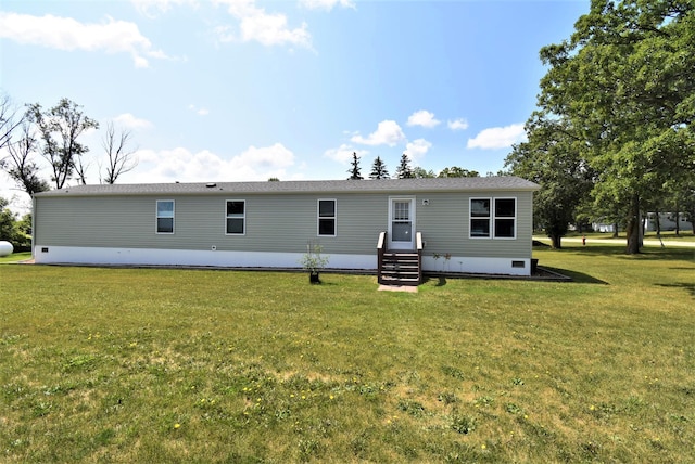 back of house featuring a yard