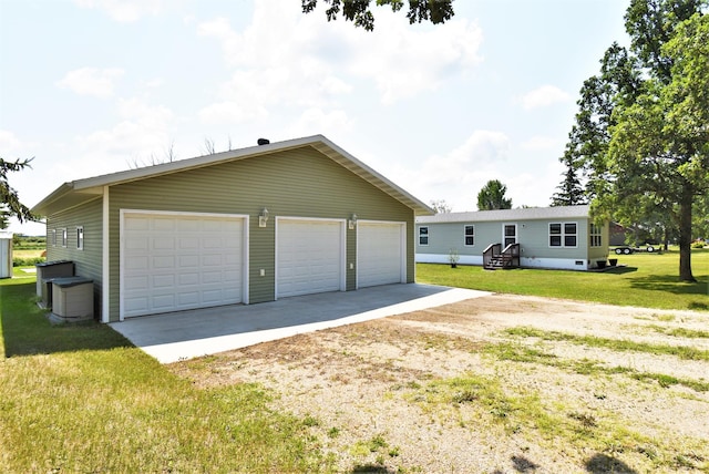 view of property exterior with an outdoor structure, a garage, and a lawn