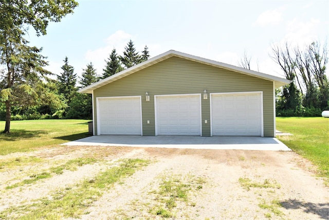 garage with a lawn