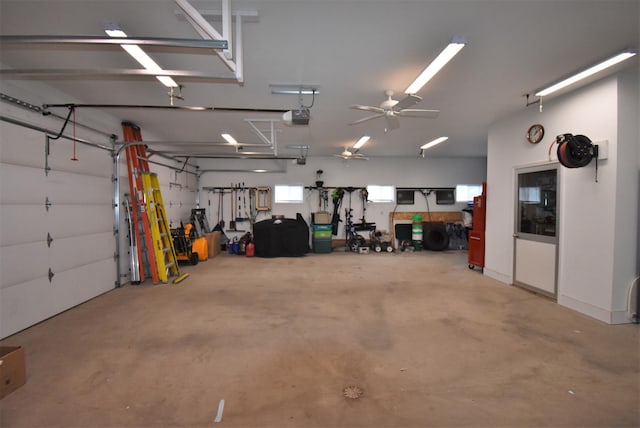 garage featuring ceiling fan and a garage door opener