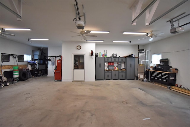 garage featuring ceiling fan and a garage door opener