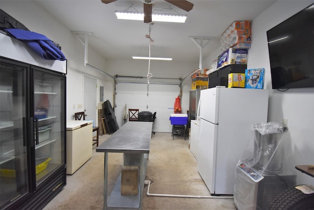 garage with white fridge, ceiling fan, and fridge