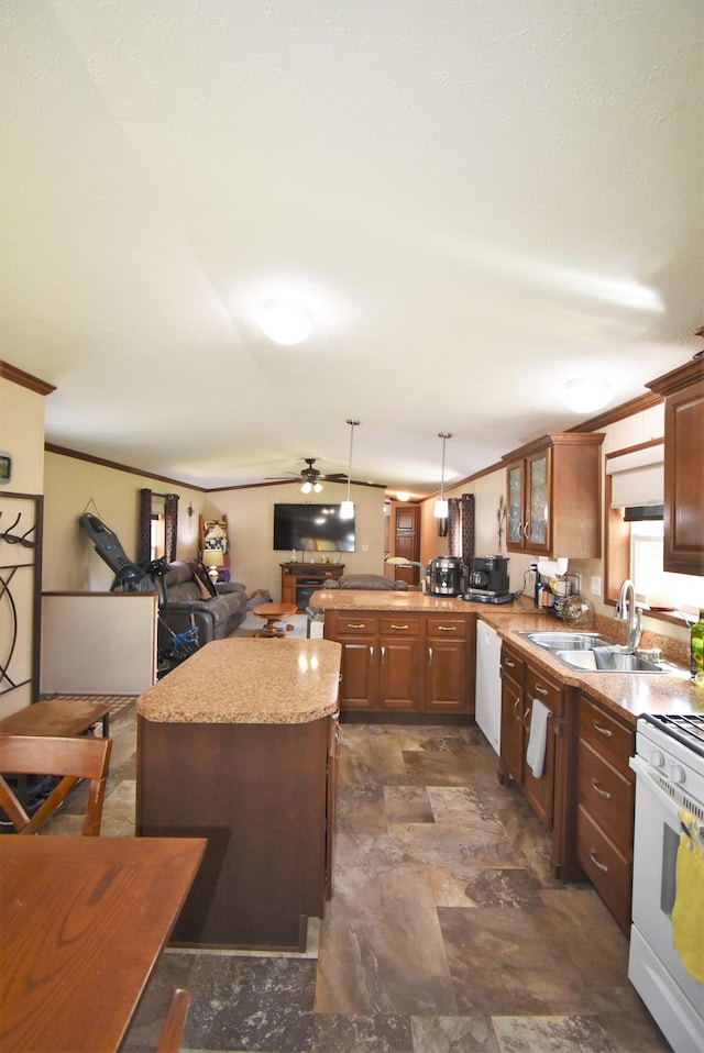 kitchen featuring ceiling fan, sink, white appliances, hanging light fixtures, and kitchen peninsula