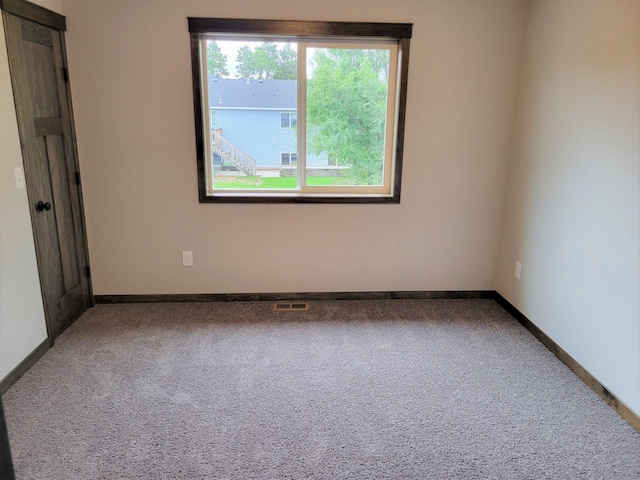 view of carpeted spare room