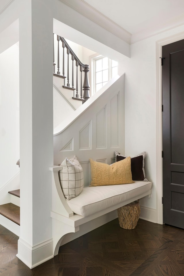 living area featuring ornamental molding