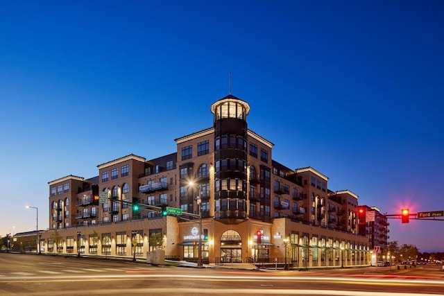 view of outdoor building at dusk