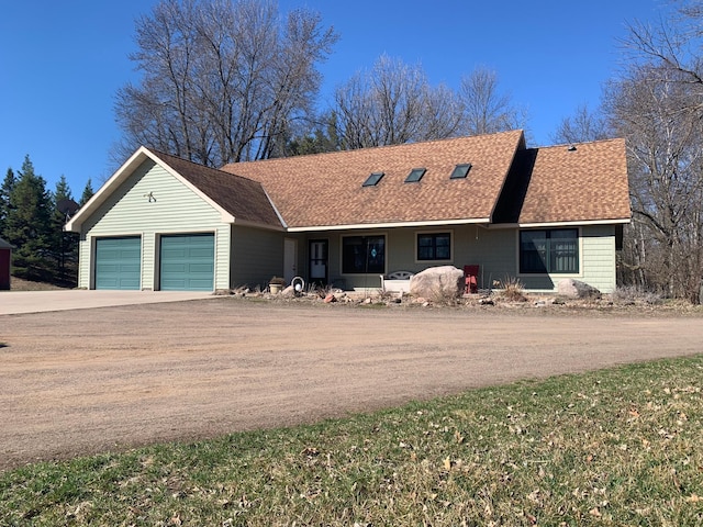 single story home featuring a garage