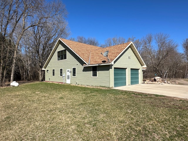 view of front facade with a garage and a front lawn