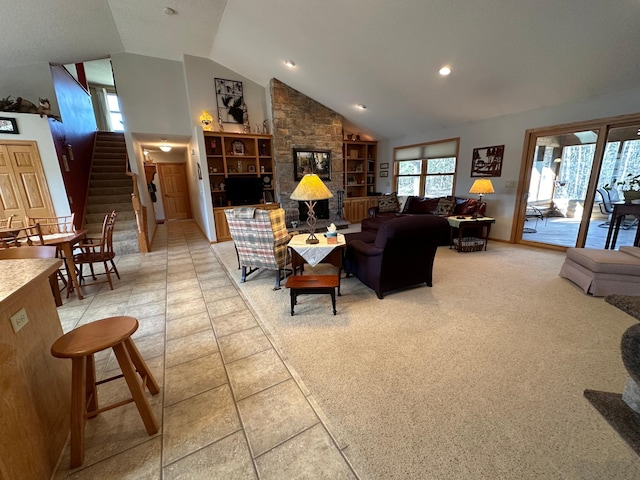 living room featuring high vaulted ceiling and light tile flooring