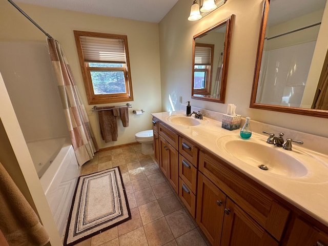 full bathroom featuring vanity with extensive cabinet space, toilet, tile flooring, shower / tub combo with curtain, and dual sinks