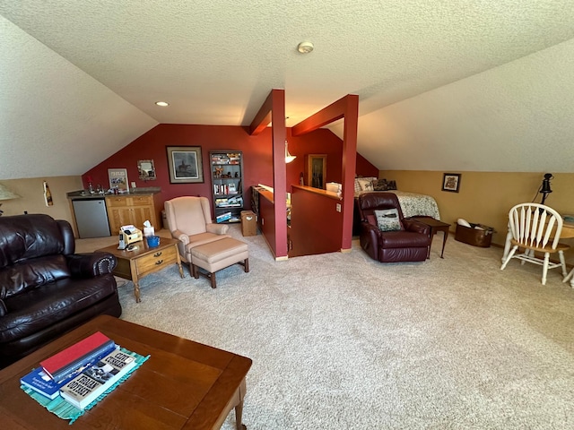 carpeted living room with a textured ceiling and lofted ceiling