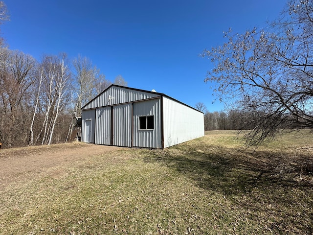 view of shed / structure with a yard