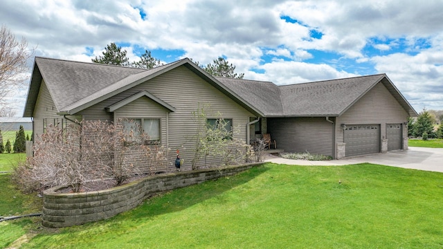 view of front of house featuring a garage and a front lawn