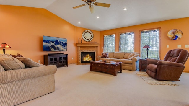 carpeted living room featuring ceiling fan and lofted ceiling