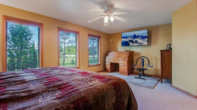 bedroom with light carpet and ceiling fan