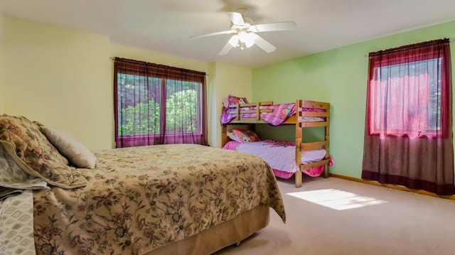 bedroom with ceiling fan and carpet