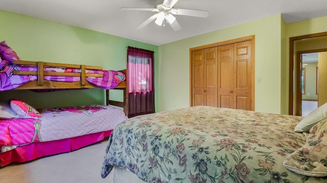 bedroom featuring a closet, ceiling fan, and carpet