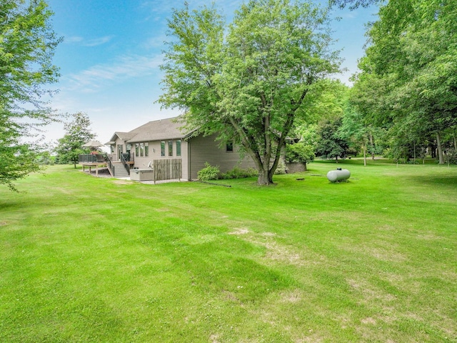 view of yard featuring a wooden deck