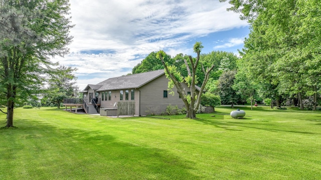 W9495 Springwood Ln, Withee Twp, WI 54771 - view of green lawn featuring a wooden deck and stairway