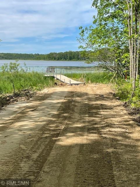 surrounding community featuring a water view