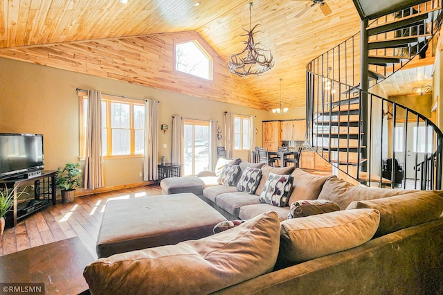 living area featuring a notable chandelier, wood-type flooring, wood ceiling, stairs, and high vaulted ceiling