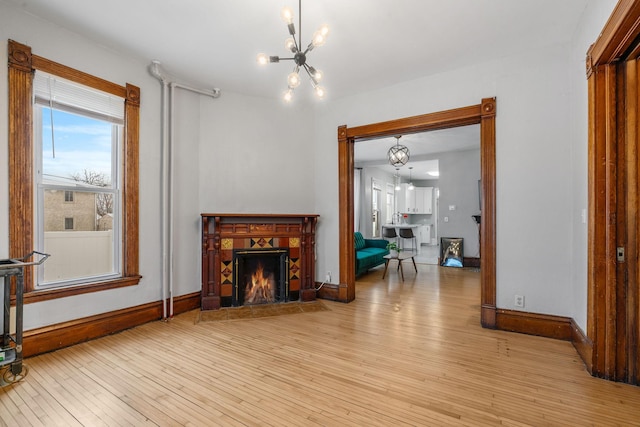 living area featuring a chandelier and light wood-type flooring