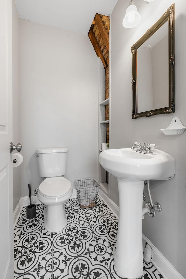 bathroom with tile patterned floors and toilet