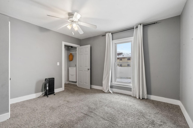 unfurnished bedroom featuring ceiling fan and carpet floors