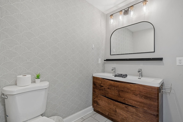 bathroom with toilet and vanity