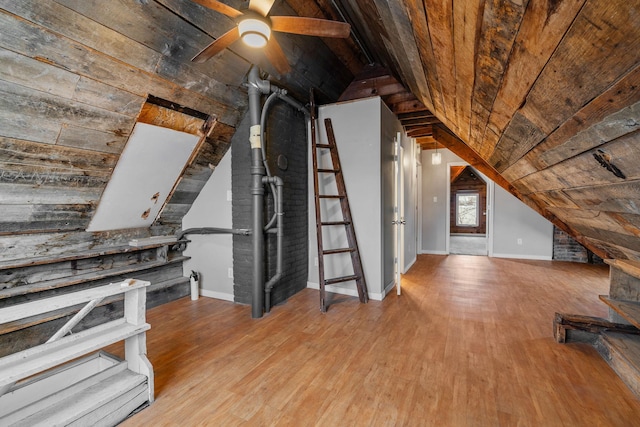 additional living space with ceiling fan, vaulted ceiling, wood ceiling, and light hardwood / wood-style floors