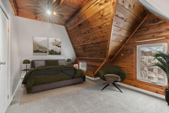 bedroom with wood ceiling, wood walls, and carpet floors